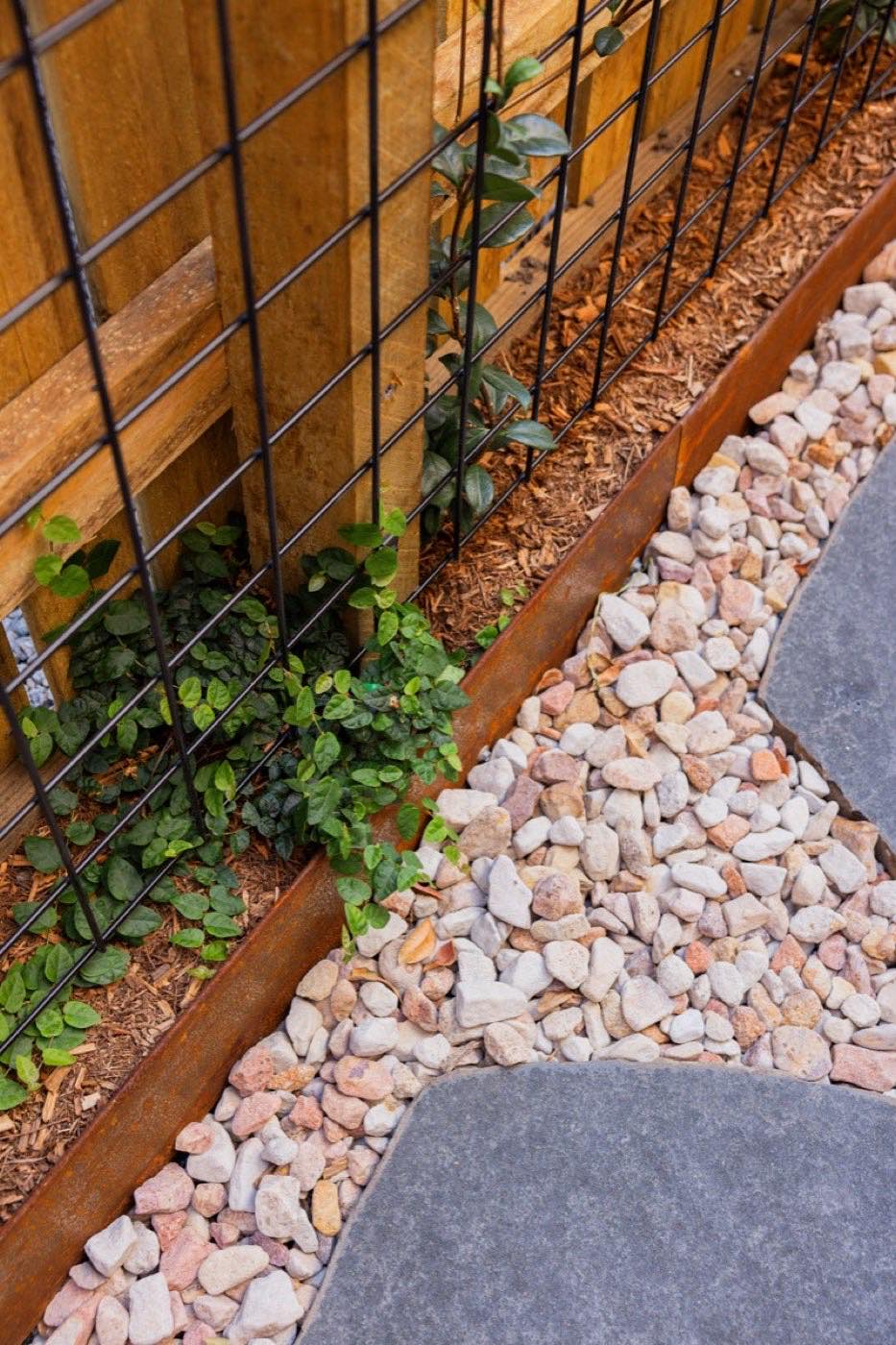 Crushed rock path with stepping stones and timber edging
