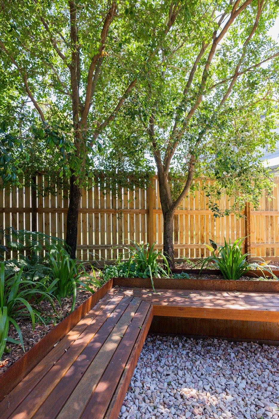 New timber paling fence with garden bed in front